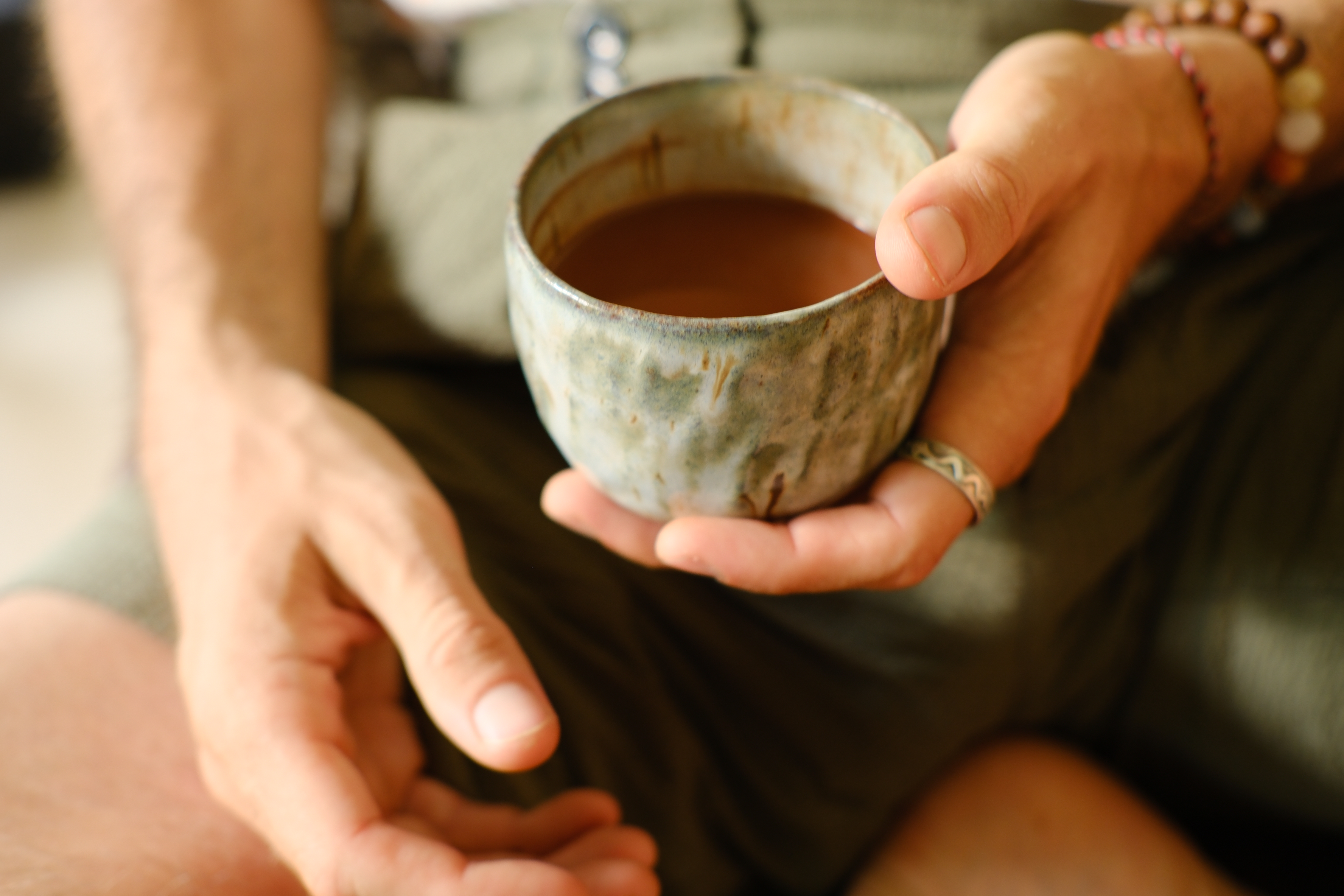 Marcus holding a cup of cacao